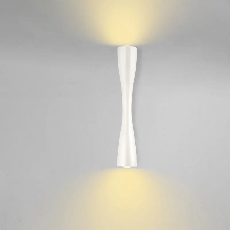 Cylindrical Nordic-style wall sconce in black, white, and gold, photo 3 of 7