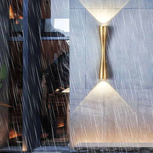 Cylindrical Nordic-style wall sconce in black, white, and gold, photo 1 of 7